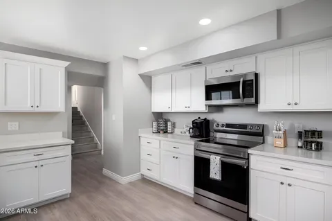 a bedroom with a bed and a couch