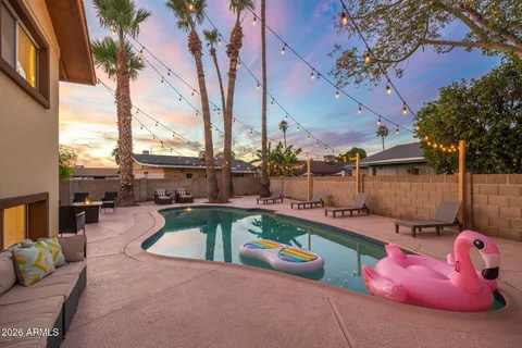 a view of a swimming pool with a chairs