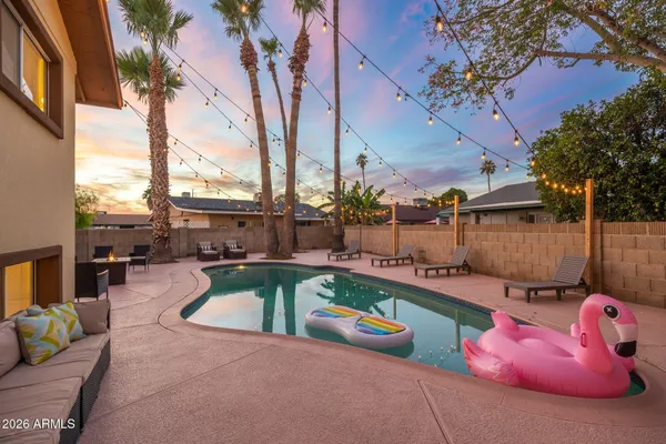 a view of a swimming pool with a chairs