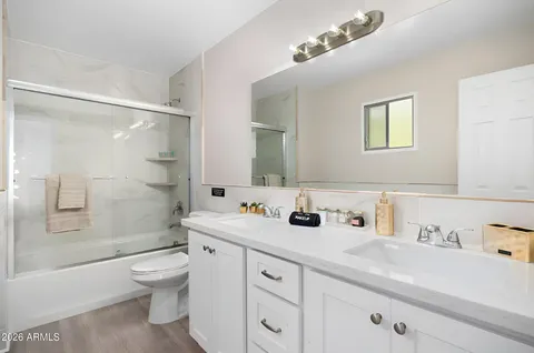 a bedroom with bunk bed and a dresser