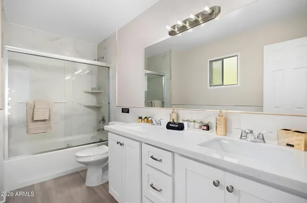 a bedroom with bunk bed and a dresser