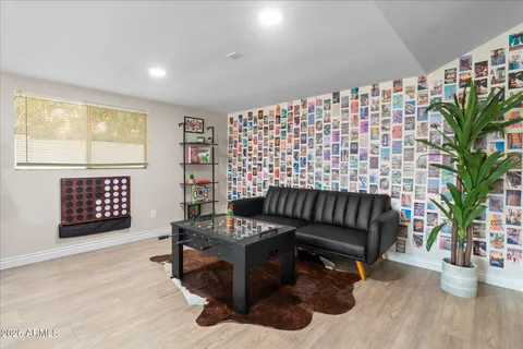 a living room with fireplace furniture and a flat screen tv