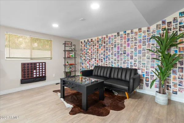 a living room with fireplace furniture and a flat screen tv