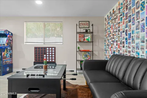 a bedroom with a bed and a ceiling fan