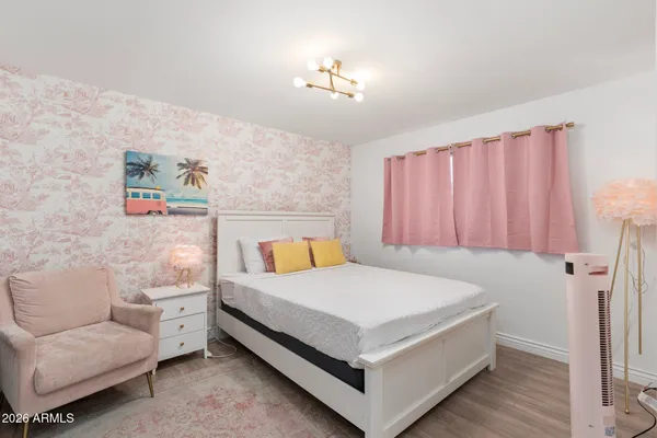 a view of a swimming pool with sitting area