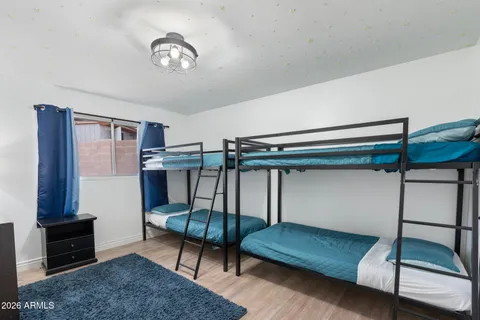 a view of a chairs and table in patio of the house