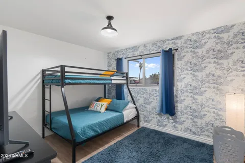 a view of a park with iron fence