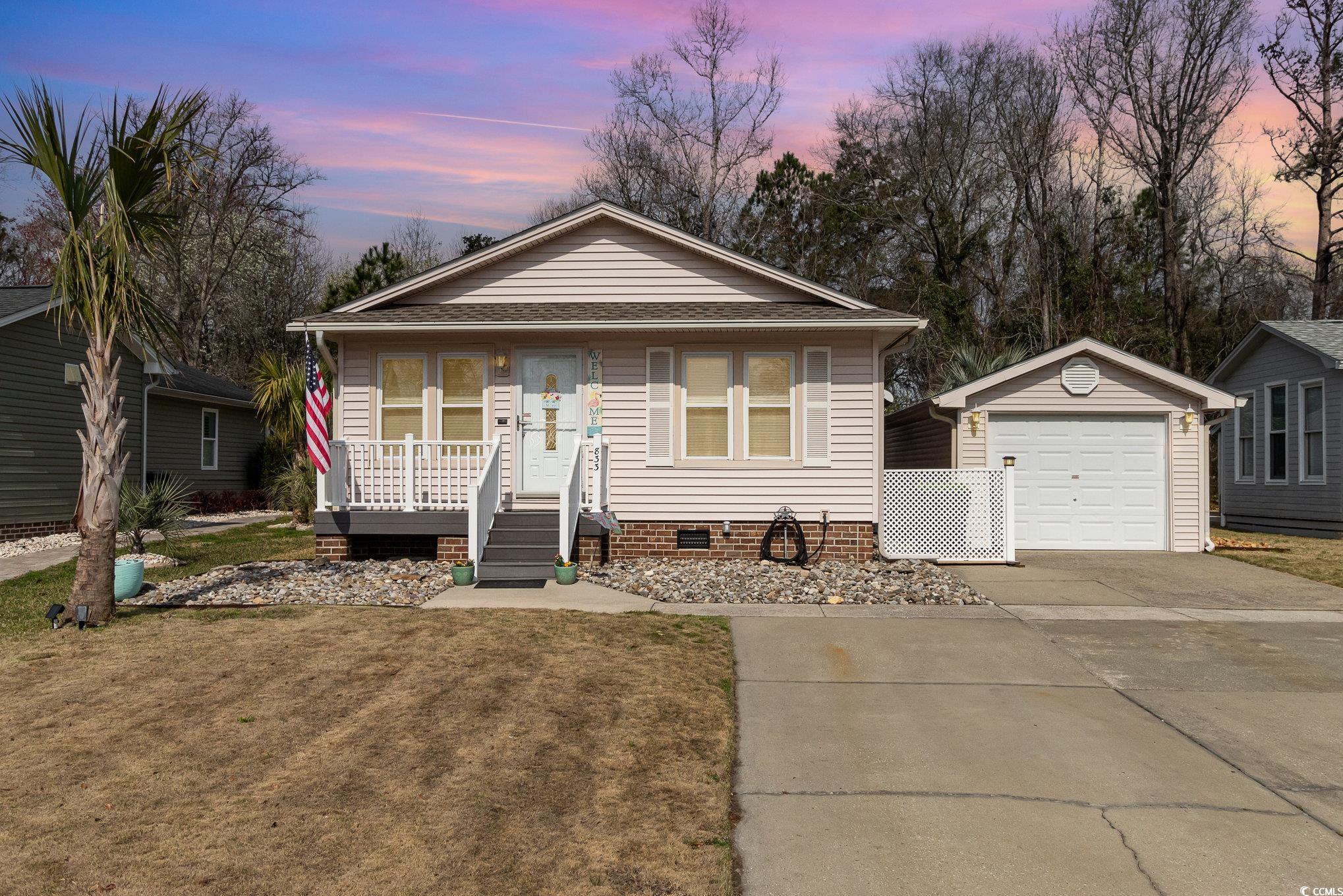 833 Main Sail Court Murrells Inlet, SC 29576 - Photo 1 of 40 Bungalow with a lawn, covered porch, an outdoor st