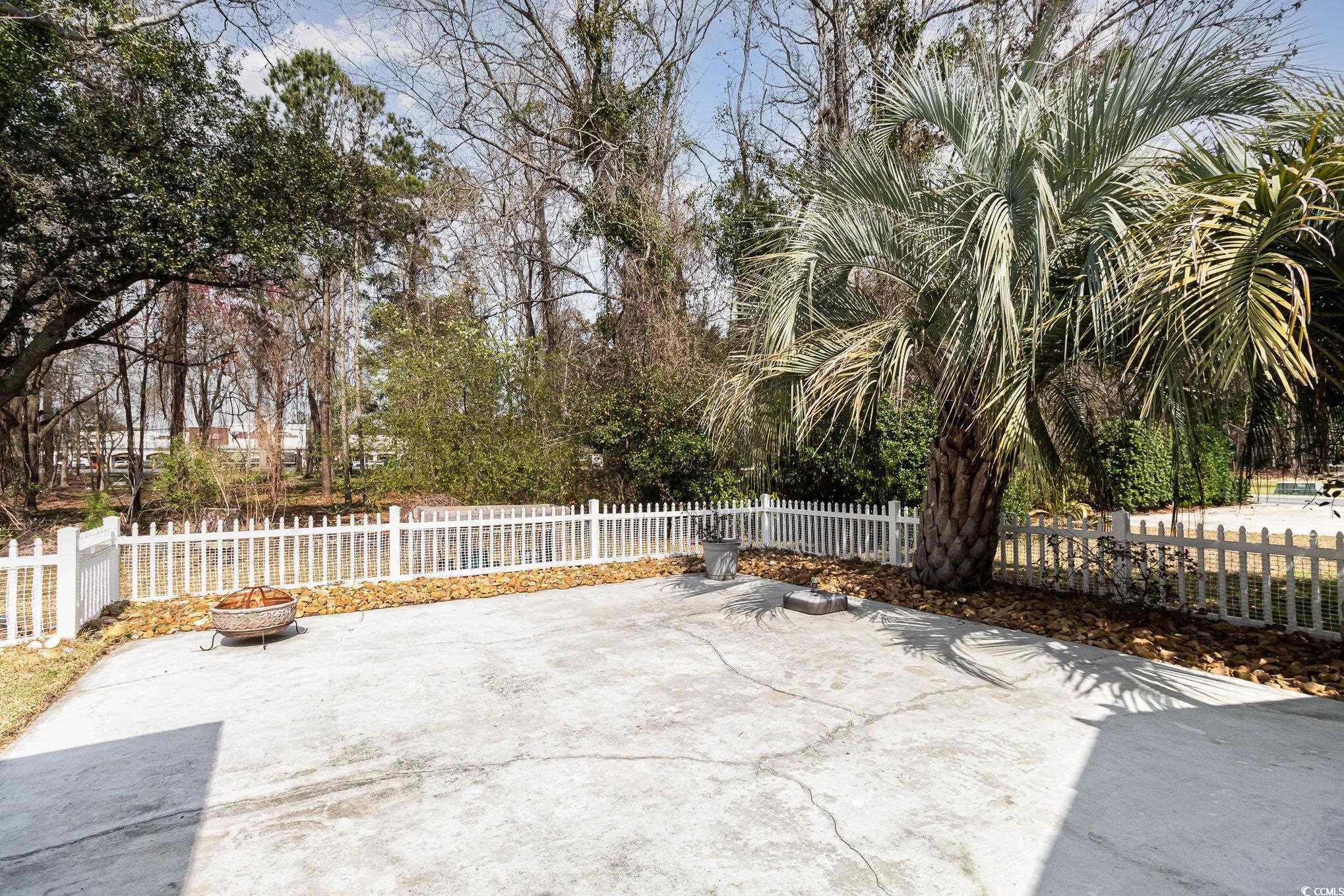 833 Main Sail Court Murrells Inlet, SC 29576 - Photo 24 of 40 View of patio featuring fence private yard and an