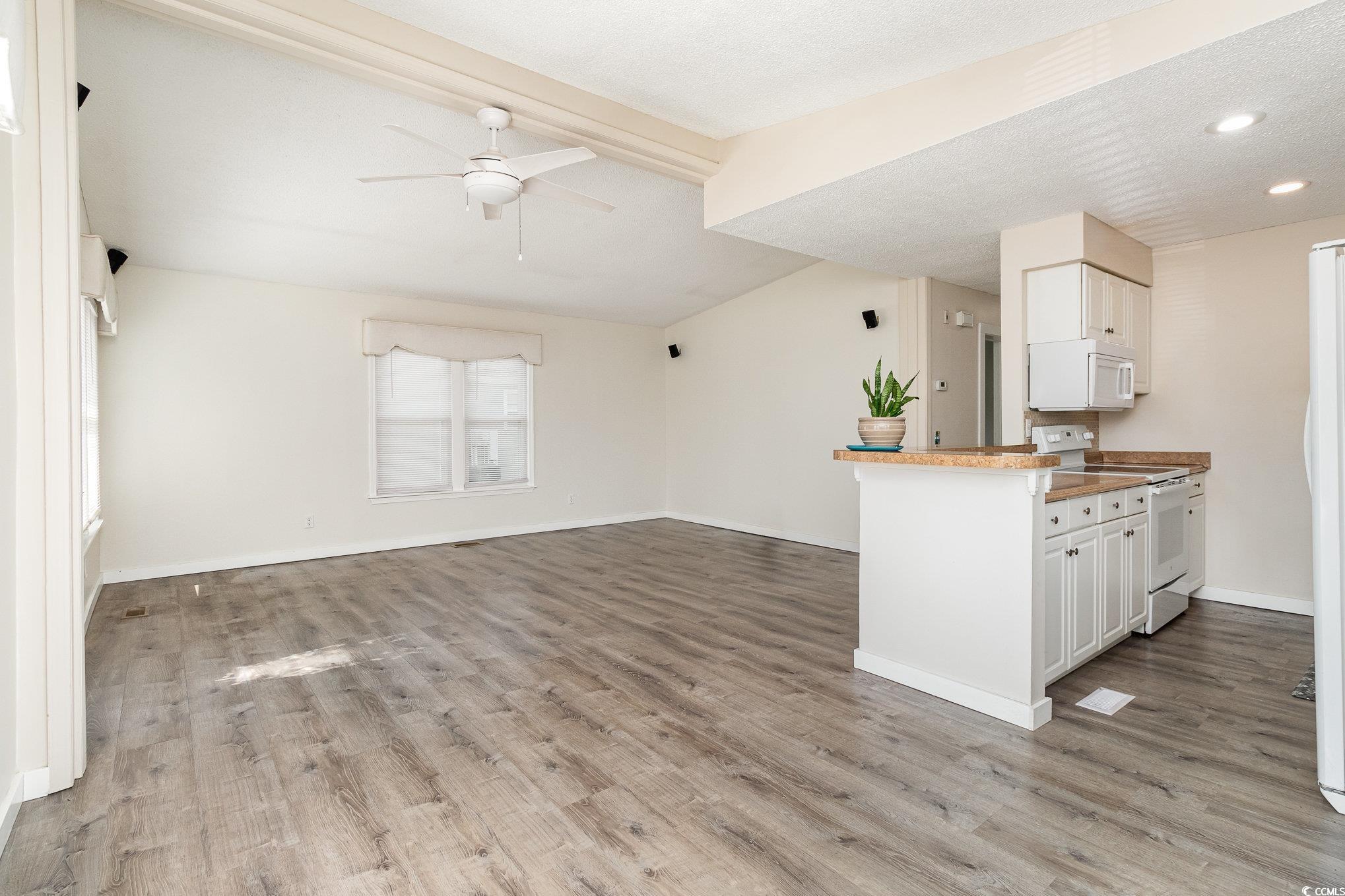 833 Main Sail Court Murrells Inlet, SC 29576 - Photo 32 of 40 Kitchen featuring white appliances, light wood-sty
