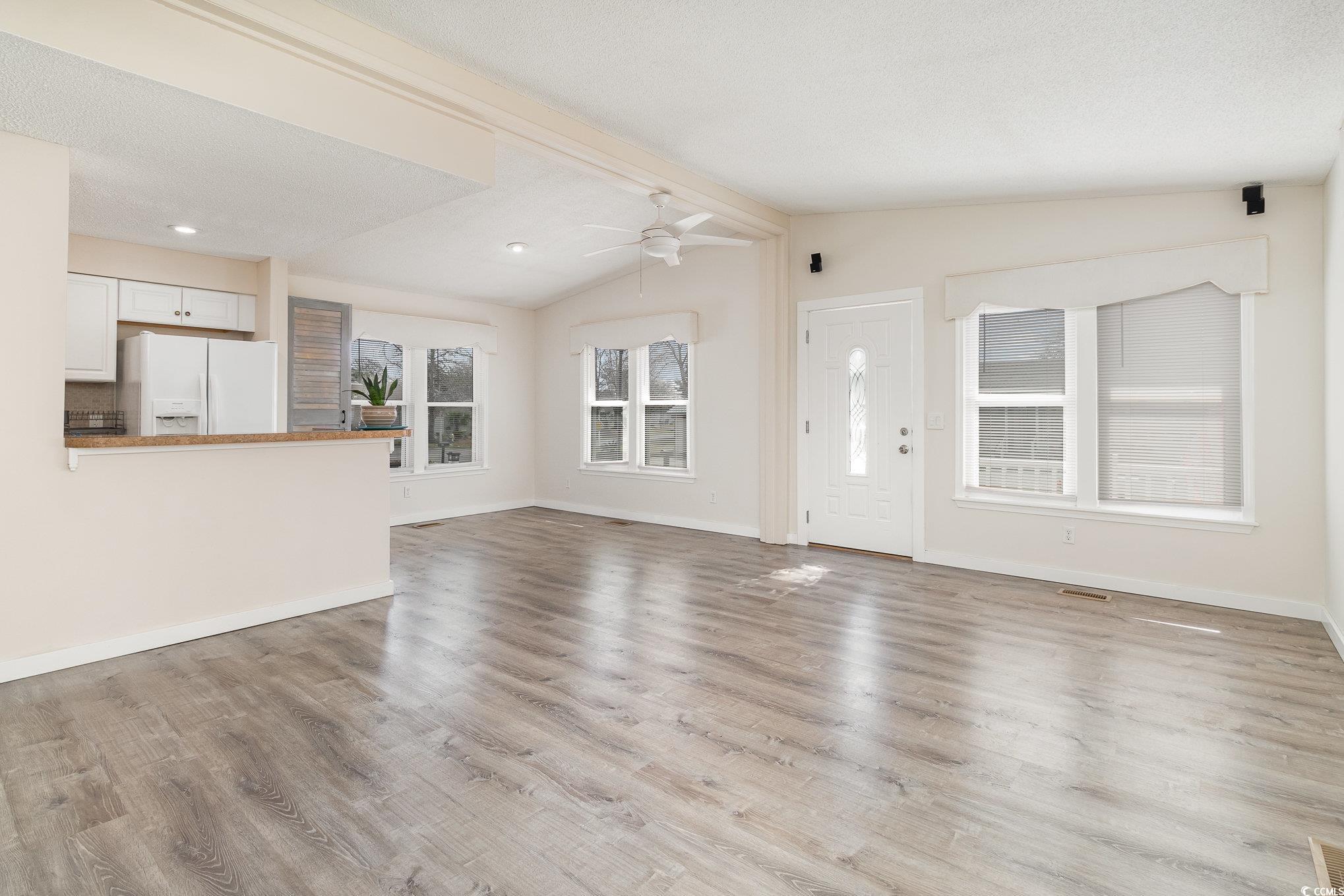 833 Main Sail Court Murrells Inlet, SC 29576 - Photo 33 of 40 Unfurnished living room with visible vents, basebo