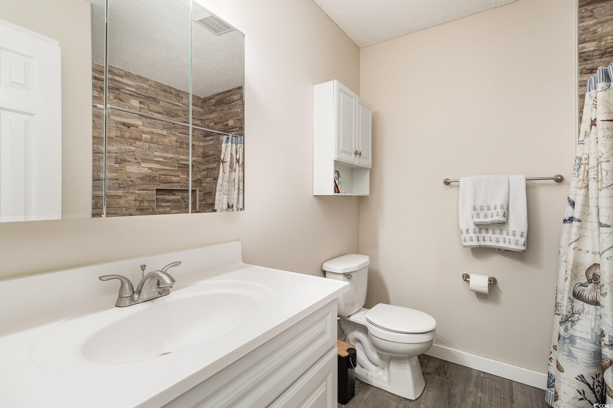 833 Main Sail Court Murrells Inlet, SC 29576 - Photo 8 of 40 Bathroom featuring toilet, wood finished floors, v