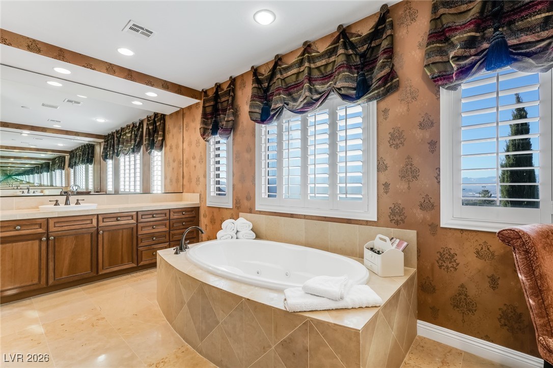 2709 Cyrano Street Henderson, NV 89044 - Photo 9 of 73 Spa like primary bath with jetted tub, large shower and dual vanities.