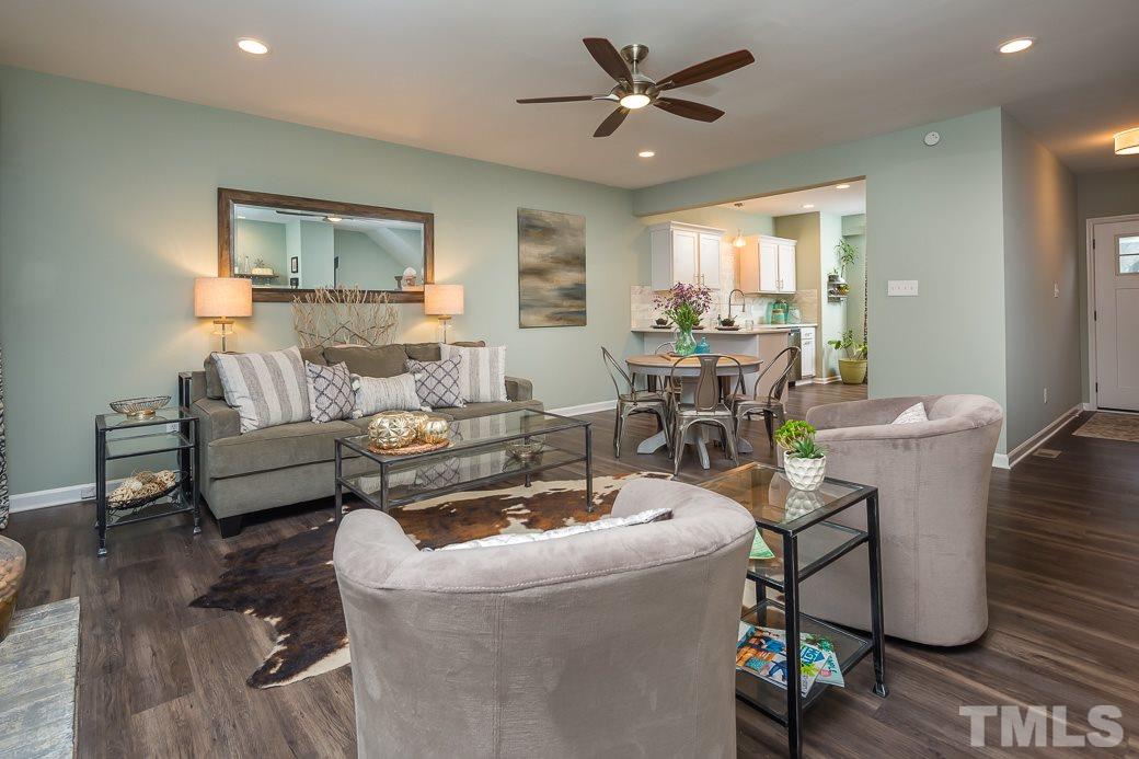 6241 Waterside Lane Raleigh, NC 27613 - Photo 5 of 16 a living room with furniture and a wooden floor