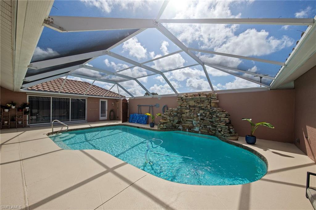 13541 Stringfellow Road Bokeelia, FL 33922 - Photo 29 of 49 a view of a house with a backyard