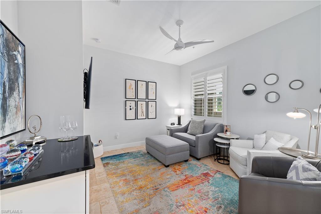 21490 Strada Nuova Circle, Unit D211 Estero, FL 33928 - Photo 13 of 45 a living room with furniture and a window