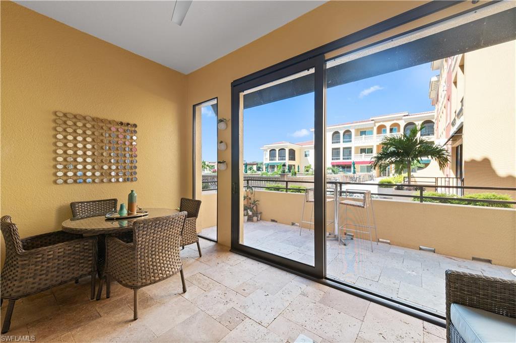 21490 Strada Nuova Circle, Unit D211 Estero, FL 33928 - Photo 32 of 45 a view of a balcony with chairs