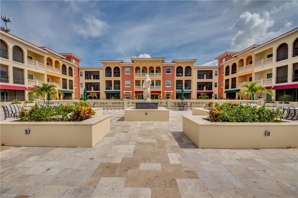 21490 Strada Nuova Circle, Unit D211 Estero, FL 33928 - Photo 33 of 45 a view of building with a outdoor space