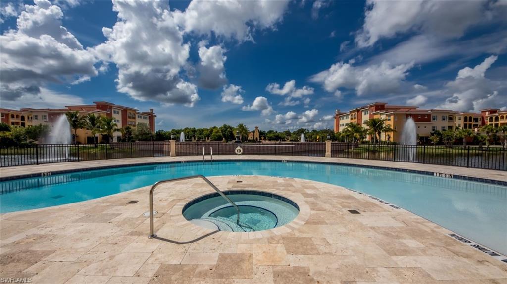 21490 Strada Nuova Circle, Unit D211 Estero, FL 33928 - Photo 38 of 45 a view of swimming pool and outdoor space