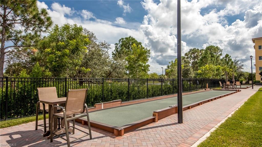 21490 Strada Nuova Circle, Unit D211 Estero, FL 33928 - Photo 43 of 45 a view of a terrace with sitting area