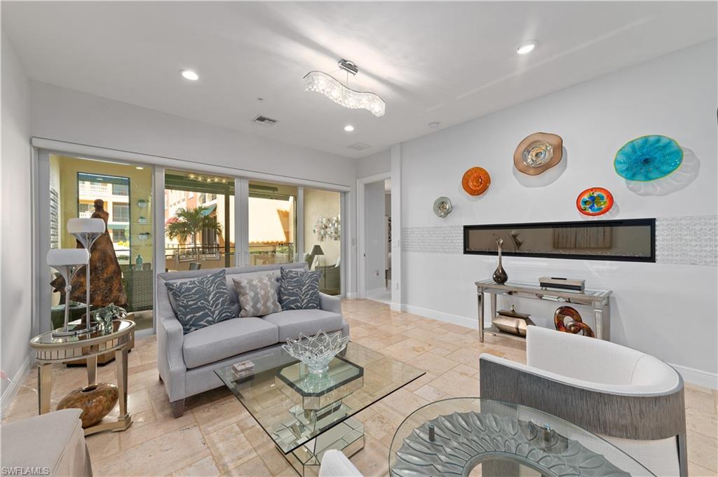21490 Strada Nuova Circle, Unit D211 Estero, FL 33928 - Photo 8 of 45 a living room with furniture and a window
