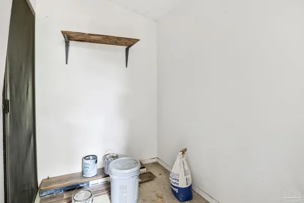 a bathroom with a toilet and a mirror