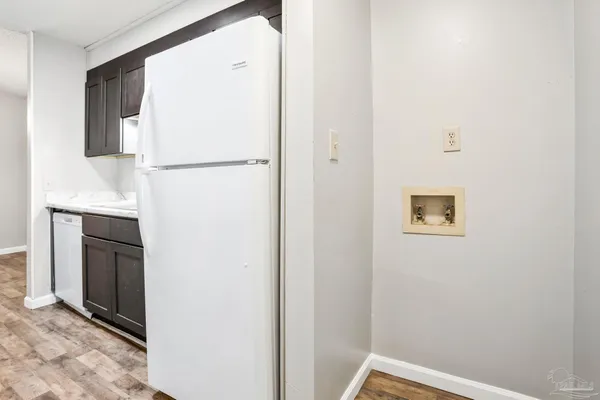 a view of hallway with cabinets