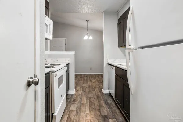 a view of a kitchen with a sink dryer and washer