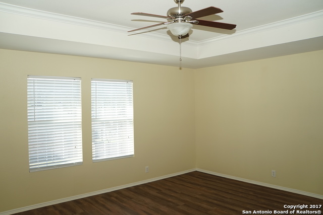 13202 Baldwin Ridge San Antonio, TX 78249 - Photo 11 of 20 a view of a room with wooden floor and fan