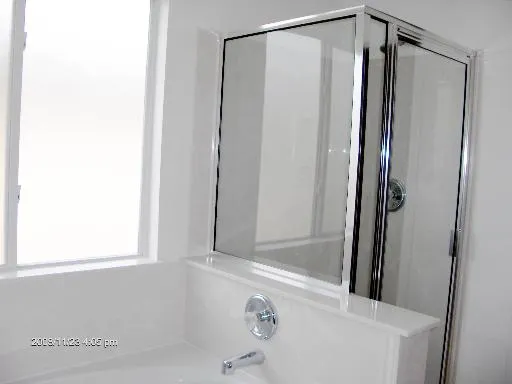 a bathroom with a sink vanity and a mirror
