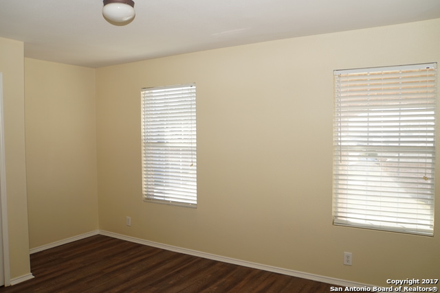 13202 Baldwin Ridge San Antonio, TX 78249 - Photo 15 of 20 a view of a room with wooden floor and a window