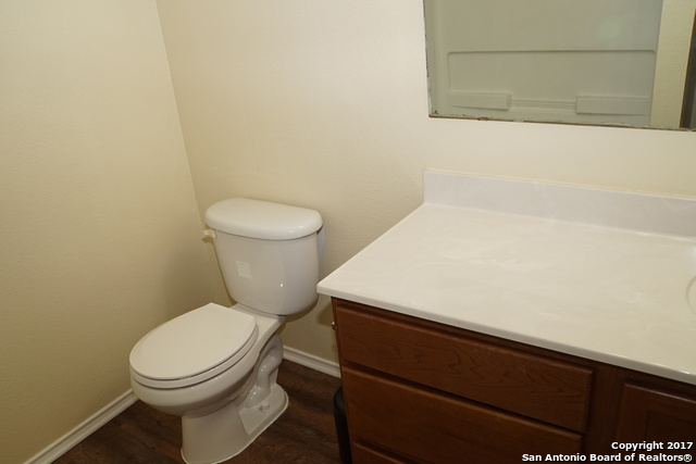 13202 Baldwin Ridge San Antonio, TX 78249 - Photo 20 of 20 a bathroom with a toilet and a mirror