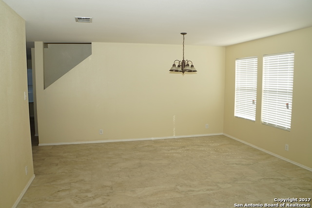 13202 Baldwin Ridge San Antonio, TX 78249 - Photo 4 of 20 a view of an empty room with a window