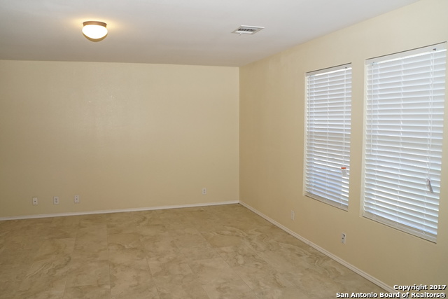 13202 Baldwin Ridge San Antonio, TX 78249 - Photo 5 of 20 a view of an empty room with a window