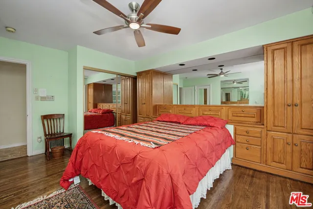 a bed room with a bed and a chandelier