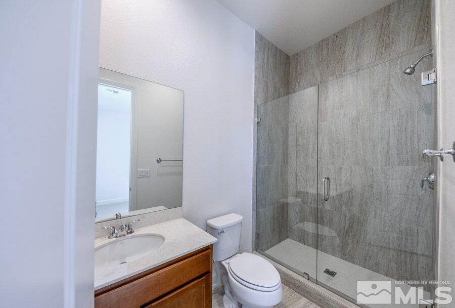 2345 Stone Rise Road, Unit SORRENTO TRAIL LOT #132 Reno, NV 89521 - Photo 2 of 11 a bathroom with a sink a toilet and shower