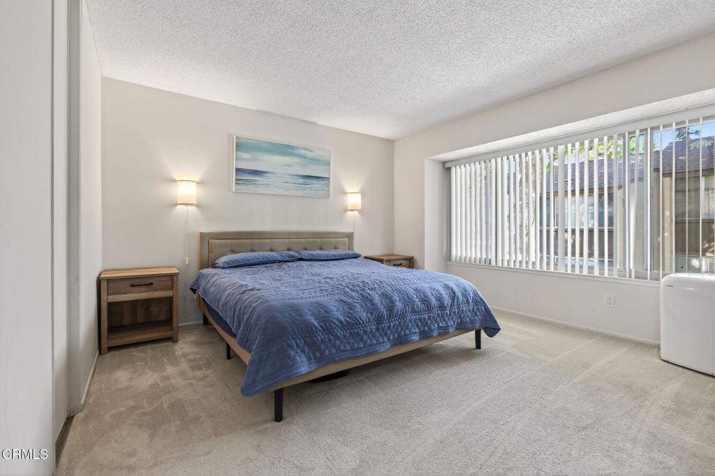 1213 Nilgai Place Ventura, CA 93003 - Photo 10 of 22 a spacious bedroom with a bed and a window