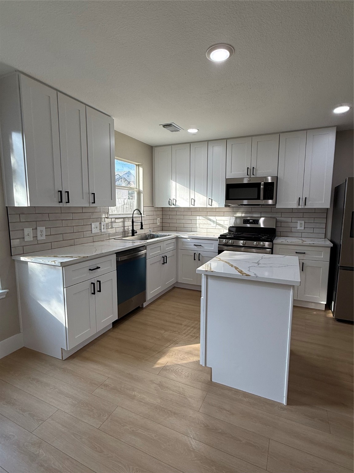 3819 Banks Ridge Lane Katy, TX 77449 - Photo 1 of 19 a kitchen with stainless steel appliances granite countertop a stove a sink dishwasher and a refrigerator