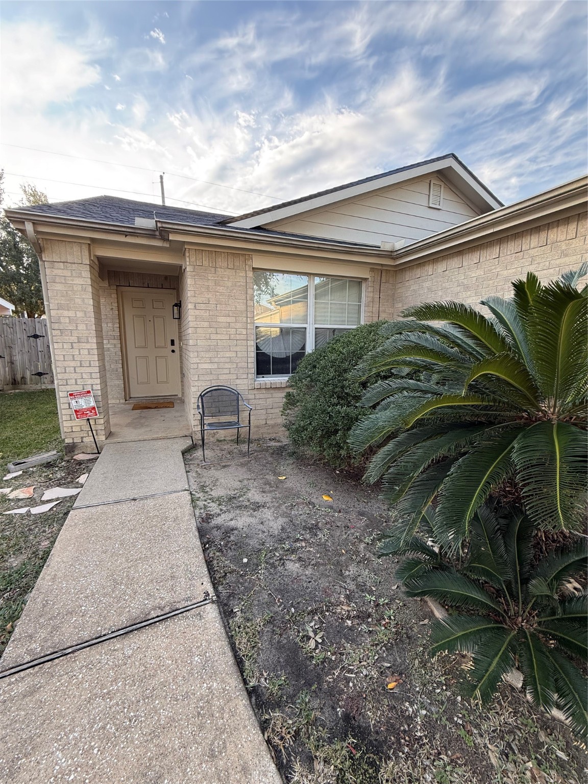 3819 Banks Ridge Lane Katy, TX 77449 - Photo 3 of 19 a view of a house with a small yard and plants