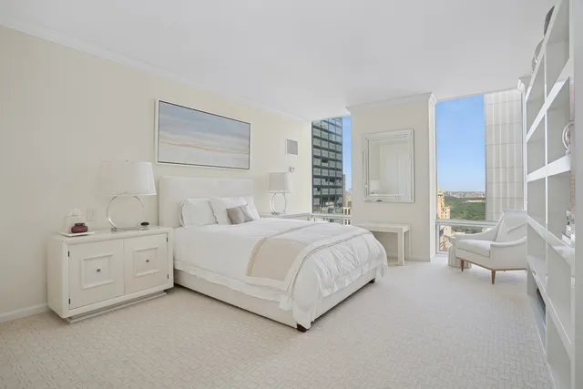 a bedroom with furniture and windows
