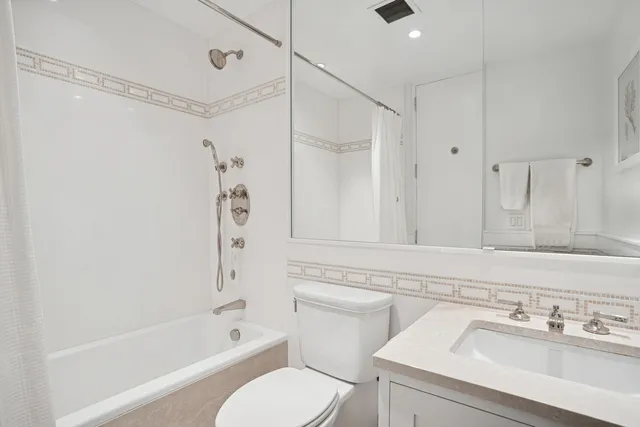 a bathroom with a sink a toilet and a bathtub