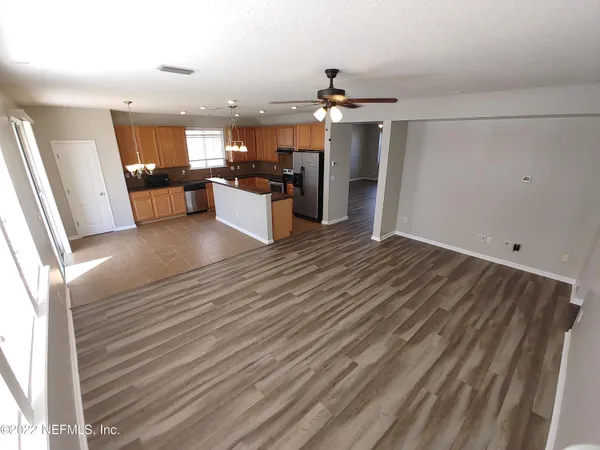 a view of a kitchen with a sink and cabinet