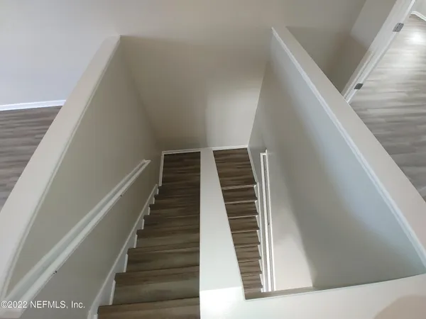 a view of a hallway with staircase