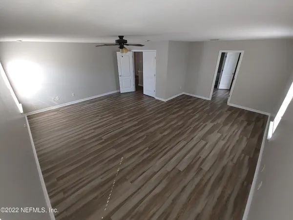 a bathroom with a double vanity sink and mirror