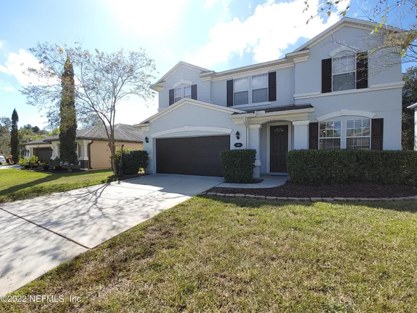 a house view with a garden space