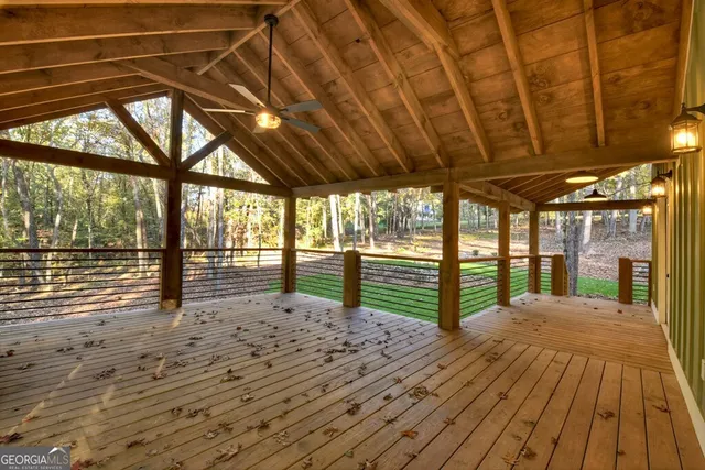 a view of porch with wooden floor
