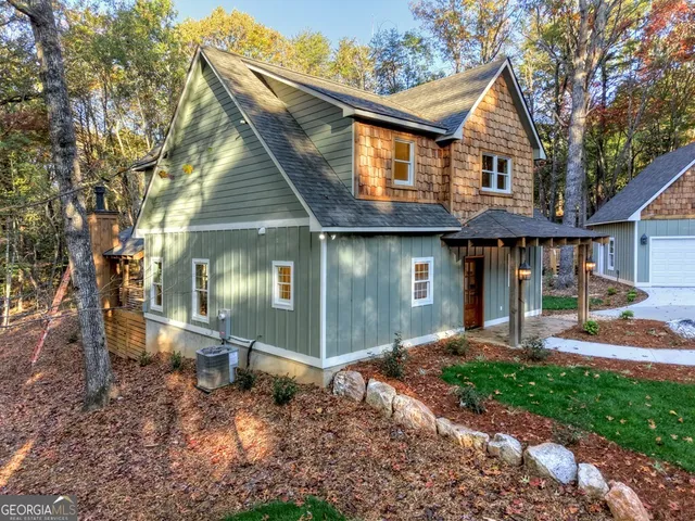 a front view of a house with a yard and porch