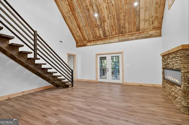 a view of an entryway with wooden floor