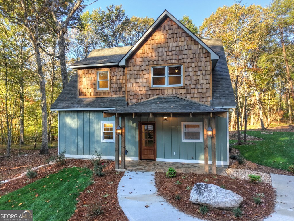 646 High Country Crossing Morganton, GA 30560 - Photo 3 of 44 a front view of a house with garden