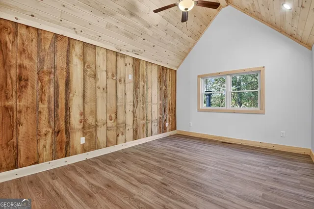 a bathroom with a toilet a sink and a mirror